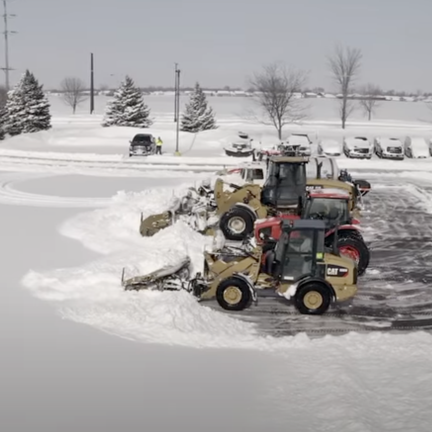 Metal Pless snow pushers plowing snow